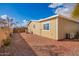 Tan colored house exterior with rock landscaping at 10951 N 91St Ave # 56, Peoria, AZ 85345