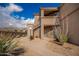 Building exterior showcasing a walkway and desert landscaping at 11680 E Sahuaro Dr # 2030, Scottsdale, AZ 85259