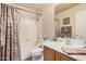 Clean bathroom with tub shower and updated vanity at 11921 W Port Royale Ln, El Mirage, AZ 85335