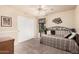 Guest bedroom with daybed and ceiling fan at 11921 W Port Royale Ln, El Mirage, AZ 85335