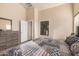 Comfortable bedroom with a queen bed and dresser at 11921 W Port Royale Ln, El Mirage, AZ 85335