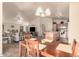 Open dining area with a view of the living room and kitchen at 11921 W Port Royale Ln, El Mirage, AZ 85335