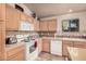 Well-equipped kitchen featuring ample cabinetry and modern appliances at 11921 W Port Royale Ln, El Mirage, AZ 85335