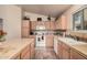 Well-equipped kitchen featuring ample counter space and cabinets at 11921 W Port Royale Ln, El Mirage, AZ 85335