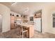 Kitchen with light wood cabinets and a large island at 11921 W Port Royale Ln, El Mirage, AZ 85335