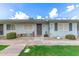 Inviting exterior of a single-story home with landscaping and a paved walkway at 13234 N 109Th Ave, Sun City, AZ 85351