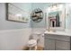 Stylish bathroom with a modern vanity and decorative wall art at 13305 W Indianola Ave, Litchfield Park, AZ 85340