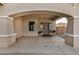 Covered front porch with a double door entry and arched entryway at 13305 W Indianola Ave, Litchfield Park, AZ 85340