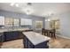 Modern kitchen with island, stainless steel appliances, and light-colored cabinetry at 13305 W Indianola Ave, Litchfield Park, AZ 85340