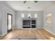 Living room with built-in entertainment center and hardwood floors at 13305 W Indianola Ave, Litchfield Park, AZ 85340