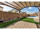 Relaxing patio area under a pergola, overlooking the pool at 13305 W Indianola Ave, Litchfield Park, AZ 85340