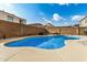 Inviting kidney-shaped pool with a large patio area at 13305 W Indianola Ave, Litchfield Park, AZ 85340