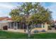 Large backyard with orange trees and grass at 14131 W Circle Ridge Dr, Sun City West, AZ 85375