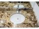 Elegant bathroom sink with granite countertop and modern faucet at 14131 W Circle Ridge Dr, Sun City West, AZ 85375