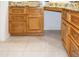 Bathroom features a vanity with granite countertop and wood cabinets at 14131 W Circle Ridge Dr, Sun City West, AZ 85375