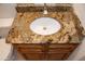 Bathroom vanity with granite countertop and sink at 14131 W Circle Ridge Dr, Sun City West, AZ 85375