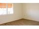 Simple bedroom with carpet and window shutters at 14131 W Circle Ridge Dr, Sun City West, AZ 85375