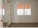 Bright bedroom with mirrored closet doors and carpet at 14131 W Circle Ridge Dr, Sun City West, AZ 85375