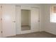 Mirrored closet doors in bedroom with neutral interior at 14131 W Circle Ridge Dr, Sun City West, AZ 85375