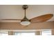 Ceiling fan with wood blades at 14131 W Circle Ridge Dr, Sun City West, AZ 85375