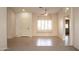 Bright and airy entryway with tile floors and window seat at 14131 W Circle Ridge Dr, Sun City West, AZ 85375