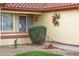 Front entry with decorative metal door and landscaping at 14131 W Circle Ridge Dr, Sun City West, AZ 85375