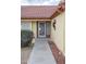 Front entry with an ornate metal security door at 14131 W Circle Ridge Dr, Sun City West, AZ 85375