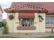 Window with decorative accents and potted plants at 14131 W Circle Ridge Dr, Sun City West, AZ 85375