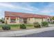 Single-story home with terracotta tile roof, landscaping, and a two-car garage at 14131 W Circle Ridge Dr, Sun City West, AZ 85375