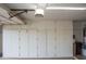 Garage with overhead storage cabinets at 14131 W Circle Ridge Dr, Sun City West, AZ 85375