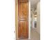 Wood cabinet in hallway with additional storage at 14131 W Circle Ridge Dr, Sun City West, AZ 85375