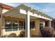 White pergola covers the back patio at 14131 W Circle Ridge Dr, Sun City West, AZ 85375