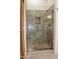 Spacious shower with glass enclosure and granite seat at 14131 W Circle Ridge Dr, Sun City West, AZ 85375