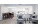 Open concept kitchen and living area with breakfast bar and modern appliances at 145 N 74Th St # 207, Mesa, AZ 85207