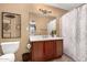 Well-lit bathroom with a single vanity and shower at 16025 E Primrose Dr # B, Fountain Hills, AZ 85268