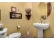 Stylish bathroom with pedestal sink and decorative artwork at 16025 E Primrose Dr # B, Fountain Hills, AZ 85268