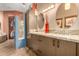 Double vanity bathroom with granite countertop and large mirrors at 16025 E Primrose Dr # B, Fountain Hills, AZ 85268