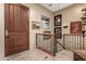 Elegant entryway with wood door and wrought iron railing at 16025 E Primrose Dr # B, Fountain Hills, AZ 85268