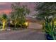 Two-car garage, desert landscaping, and Spanish-style home at 16025 E Primrose Dr # B, Fountain Hills, AZ 85268