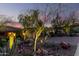 Landscaped yard with cacti and a view of a Spanish-style home at 16025 E Primrose Dr # B, Fountain Hills, AZ 85268