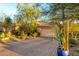 Landscaped yard with cacti and a view of a Spanish-style home at 16025 E Primrose Dr # B, Fountain Hills, AZ 85268