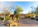 Spanish style home with a two-car garage and desert landscaping at 16025 E Primrose Dr # B, Fountain Hills, AZ 85268