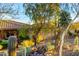 Landscaped yard with cacti and a view of a Spanish-style home at 16025 E Primrose Dr # B, Fountain Hills, AZ 85268