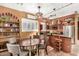 Kitchen with island, dining area, and wood cabinets at 16025 E Primrose Dr # B, Fountain Hills, AZ 85268