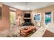 Living room with fireplace and view of bedroom at 16025 E Primrose Dr # B, Fountain Hills, AZ 85268