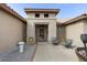 Front entry with seating area and desert landscaping at 16036 W Sandia Park Dr, Surprise, AZ 85374