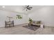 Light and airy living room with wood-look floors and a cozy seating area at 1653 N 69Th Ave, Phoenix, AZ 85035