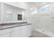 Bathroom with granite double vanity and shower at 1714 W Spaulding Ave, Apache Junction, AZ 85120