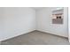 Simple bedroom with carpet flooring and window at 1714 W Spaulding Ave, Apache Junction, AZ 85120