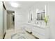 Modern bathroom with double vanity, large mirror, and walk-in shower at 1717 N 1St Ave # 215, Phoenix, AZ 85003